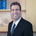 Greg E. Mann